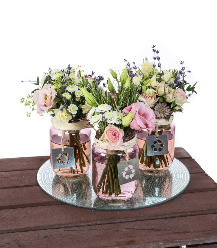 pretty pink blue and white flower trio in glass containers