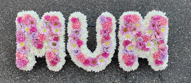 letters, name, mum, mummy, pinks, yellows, whites, mother,  funeral flowers, oasis, tribute, wreath,delivery, harold wood, romford, havering