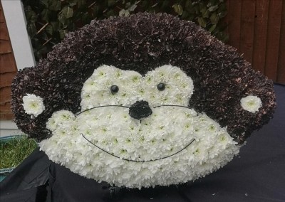 monkey, ape, chimp, cheeky, funeral, flowers, tribute, wreath, oasis, florist, harold wood, romford, havering, delivery