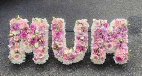 letters, name, mum, mummy, pinks, yellows, whites, mother,  funeral flowers, oasis, tribute, wreath,delivery, harold wood, romford, havering