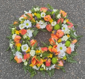 wreath, circle, bright, forange, green, white, oasis, based, funeral, tribute, flowers, harold wood, romford, florist, delivery, brentwood, dagenham